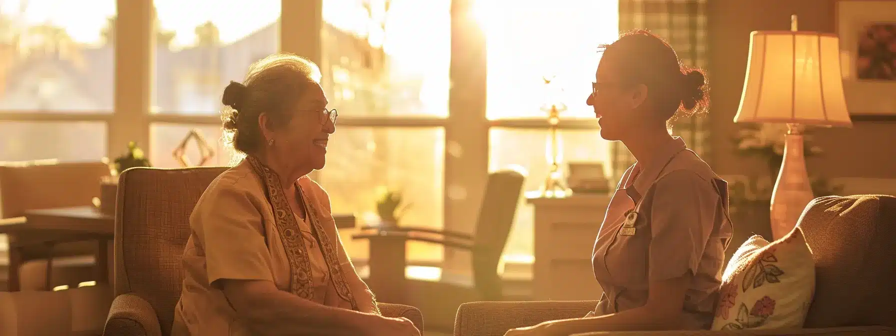 a compassionate caregiver interacts with an elderly client in a well-lit, inviting assisted living facility, showcasing a warm environment designed for personalized dementia care support.