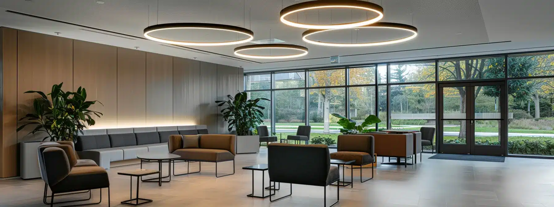 a modern alzheimer care facility in michigan, featuring a spacious, well-equipped common area with soft, ambient lighting, comfortable seating arrangements, and thoughtful decor designed to promote safety and tranquility for residents.
