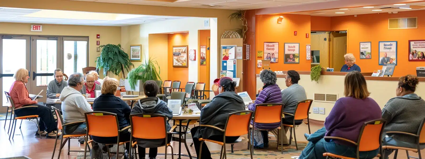 a warm, inviting community center interior showcases a diverse group of caregivers and families engaged in a supportive workshop focused on affordable dementia care resources, with informative brochures and resource banners prominently displayed.