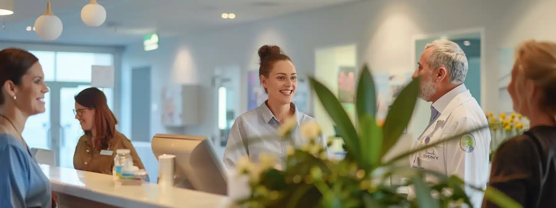 a well-lit, modern dementia care facility reception area showcases professional staff engaging warmly with families, emphasizing a welcoming environment that reflects quality care and support for residents.